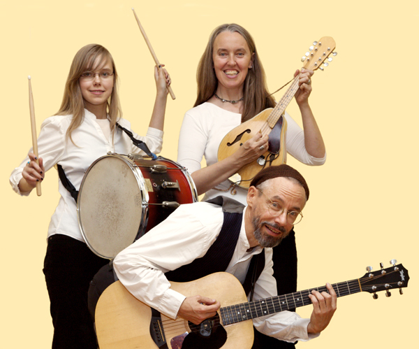 Photo of Ensemble M’chaiya (tm) as a trio - From left to right: Zo&iuml; Doehrer playing percussion, Jutta Distler playing mandolin, Terran Doehrer playing guitar. Photo by Dan Tong. &copy; 2010 Modal Music, Inc. (tm) All rights reserved.