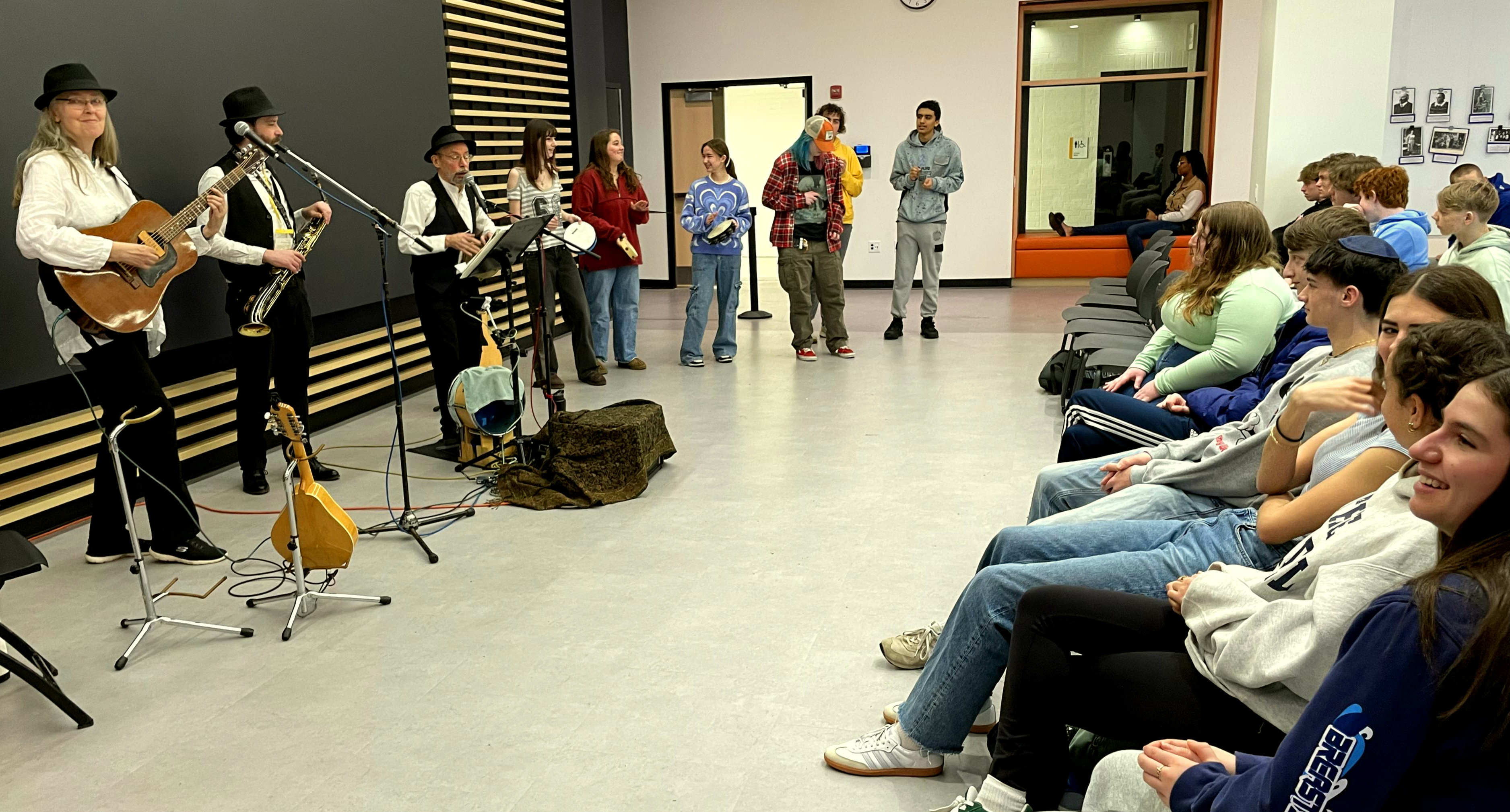 Sephardim lecture at ETHS 2025 with students drumming alongside the Ensemble M'chaiya.